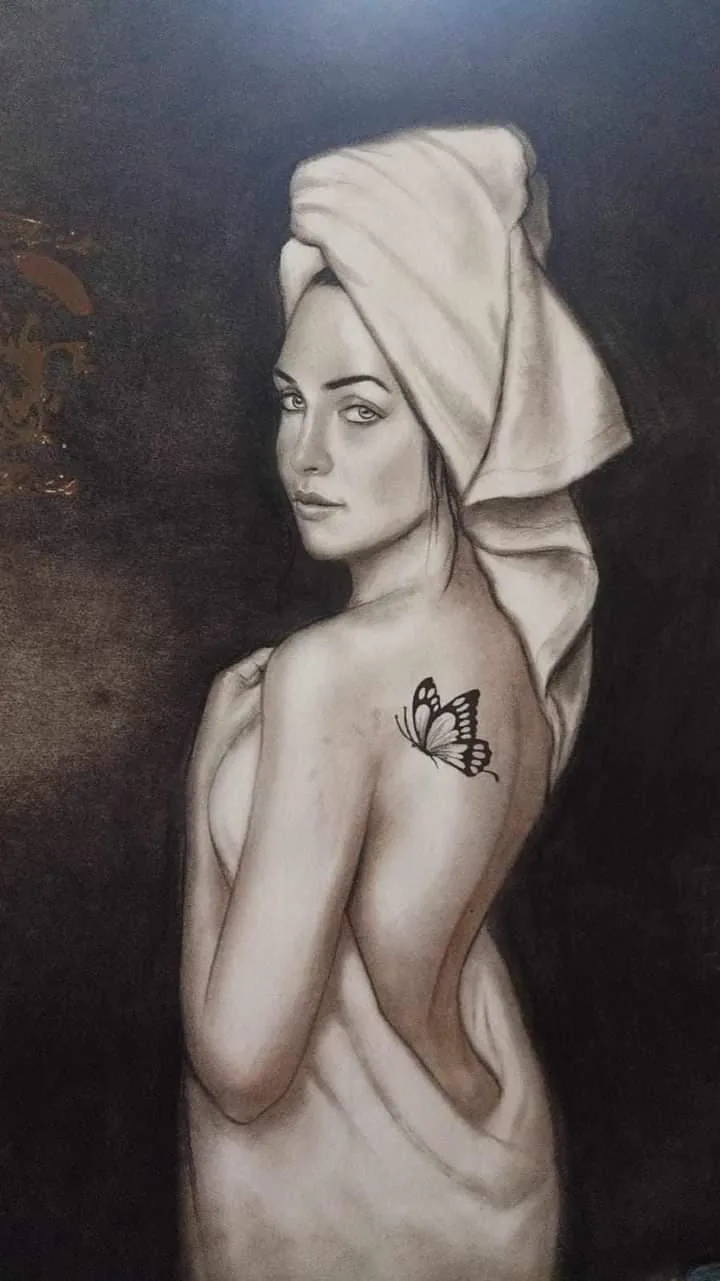 Charcoal portrait of a woman in a towel turban with a butterfly on her shoulder