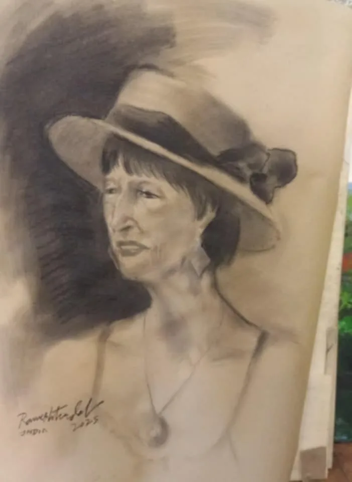Charcoal portrait of a woman wearing a brimmed hat