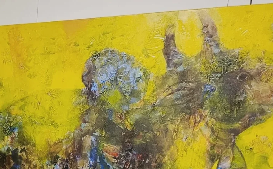 Detail of a textured yellow abstract painting